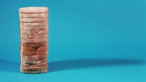 Slices of bread on a blue background Stock Footage 205872395