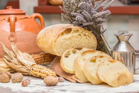 Slices of bread. Composition with bread, flour, corn and other ingredients. Stock Photos