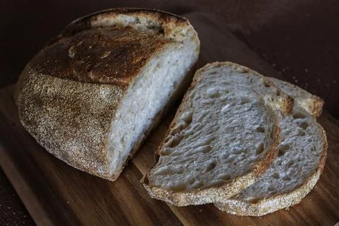 Slices of bread on cutting board Stock Photos