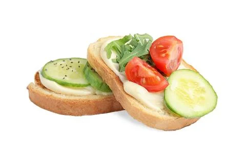 Slices of bread with different toppings on white background Foto stock