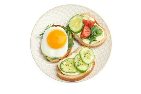 Slices of bread with different toppings on white background, top view Foto stock