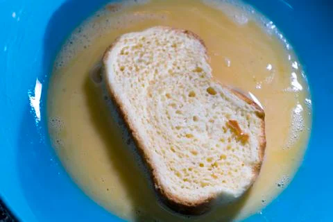  Slices of bread dipped in milk with sugar and beaten egg Stock Photos