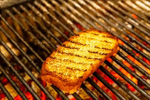 Slices of bread fried on the grill Stock Photos