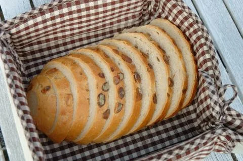 Slices of bread inside bread bin Stock Photos