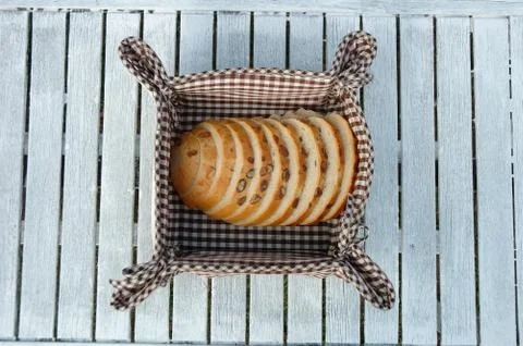 Slices of bread inside bread bin Stock Photos