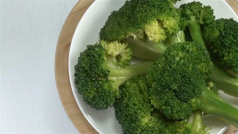 Slices of broccoli cabbage on a plate Stock Footage 140775368