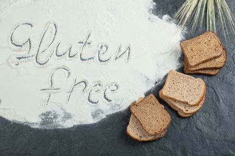 Slices of brown bread with flour and wheat Stock Photos