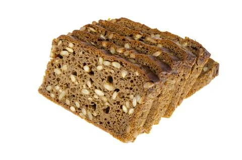 Slices of brown rye bread with sunflower seeds isolated on white background. Stock Photos