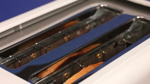 Slices of burnt toast ejected from an electric toaster 動画素材 1020345