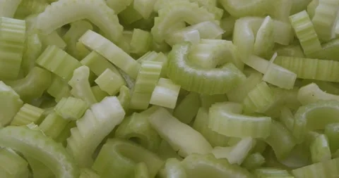 Slices of celery closeup rotating selective focus Stock Footage 157385396