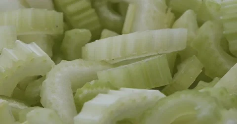 Slices of celery closeup rotating selective focus 動画素材 166105069