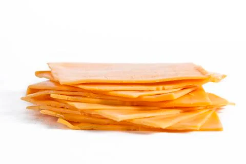 Slices of cheddar cheese Stock Photos