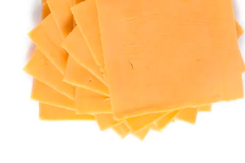 Slices of cheddar cheese Stock Photos