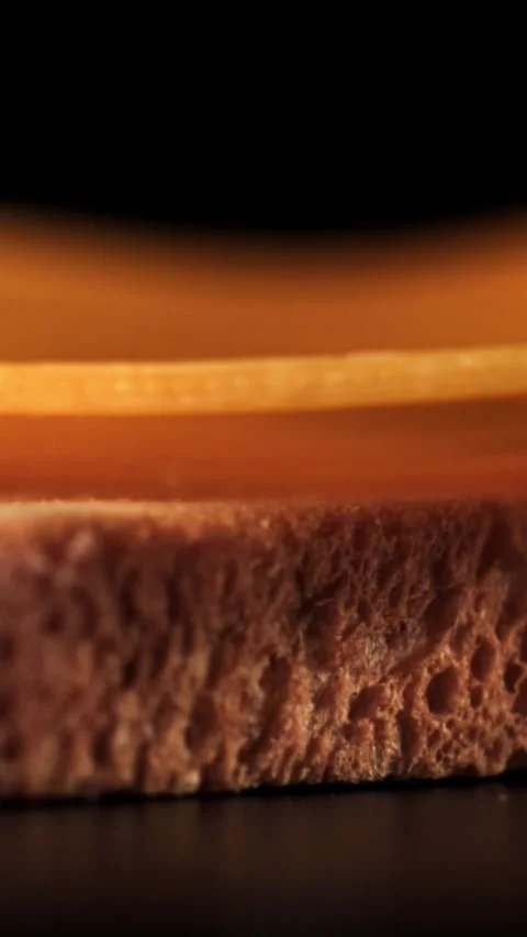 Slices of cheese fall on the bread. Filmed on a high-speed camera at 1000 fps Stock Footage 335385346
