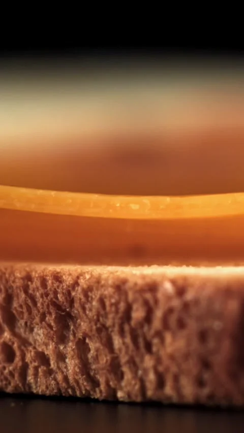Slices of cheese fall on the bread. Filmed on a high-speed camera at 1000 fps Stock Footage 335385403