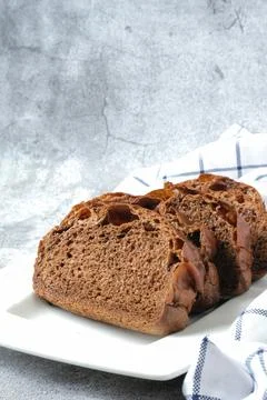 Slices of chocolate soft bread in white plate Stock Photos