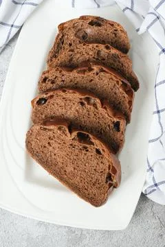 Slices of chocolate soft bread in white plate Stock Photos