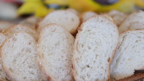 Slices crusty bread wheat sliced baguette from one place to another, a sliced Stock Footage 310157141