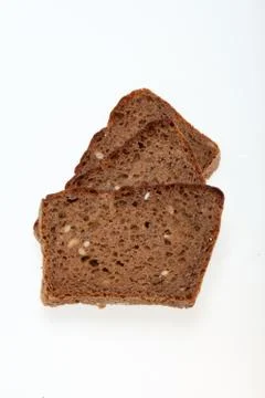 Slices of dark bread isolated over white Stock Photos