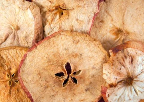 Slices of dried apple as a background. Close up image Stock Photos