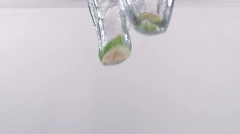 Slices Of Fig Dropping Into Water Stock Footage 52959138