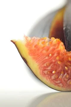 Slices of fig on a white background Stock Photos