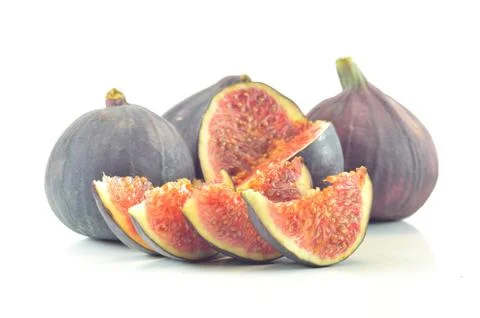 Slices of fig on a white background Stock Photos