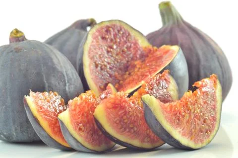 Slices of fig on a white background Stock Photos