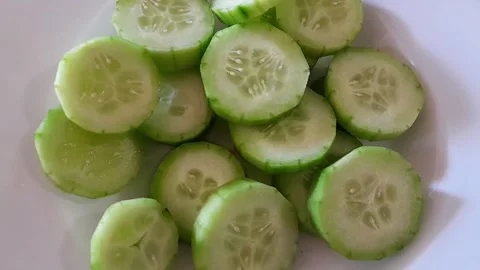 Slices of fresh, bright green cucumbers salad Stock Footage 342435337