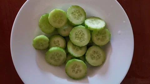 Slices of fresh, bright green cucumbers salad Stock Footage 342435353