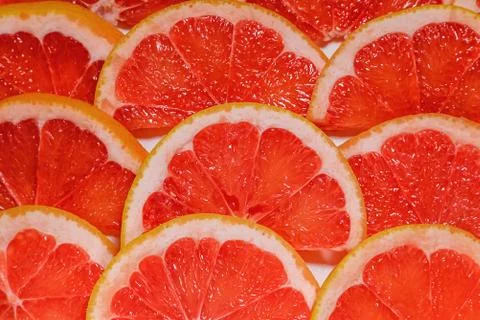 Slices of grapefruit. Citrus composition on a white background Stock Photos