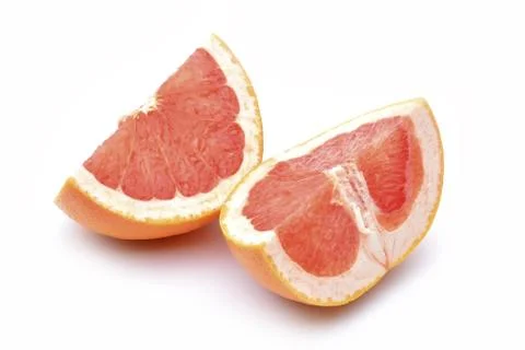 Slices of grapefruit on a white background. Fotos de archivo