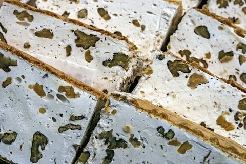 Slices of halva with nuts Stock Photos