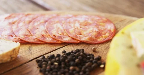 Slices of ham, cheese and spices Stock Footage