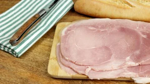 Slices of ham, close-up, on a table 스톡 사진