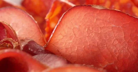 Slices of jerky beef extreme close-up. prosciutto macro shot. meat delicacy. Stock Footage 242496225