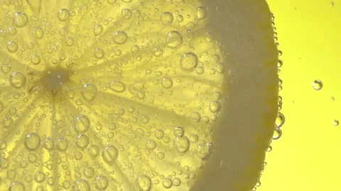 Slices of Lemon Fruit with Water Bubbles Close Up Macro Slow Motion Video stock 123128861