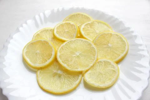 Slices of lemon on a white Stock Photos