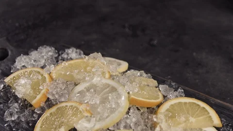 Slices of lemons lying on the ice Video stock 113081990