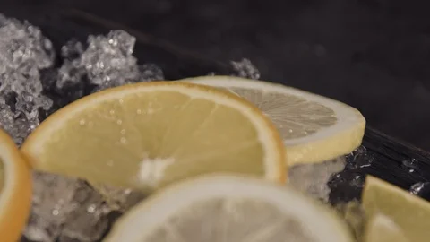Slices of lemons lying on the ice on Stock Footage 113081992