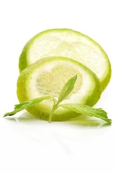 Slices of lime with a branch mint Stock Photos