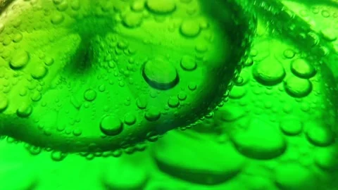 Slices of lime in cocktail 스톡 동영상 97713602