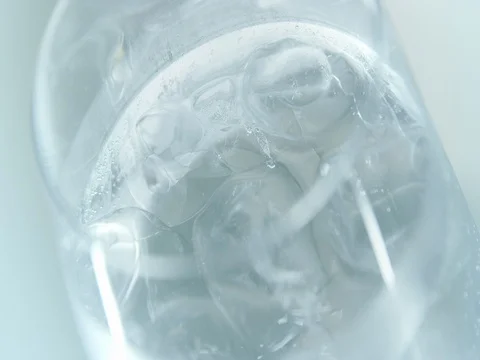 Slices of lime falling in a drink in slow motion Stock-Footage 76675173