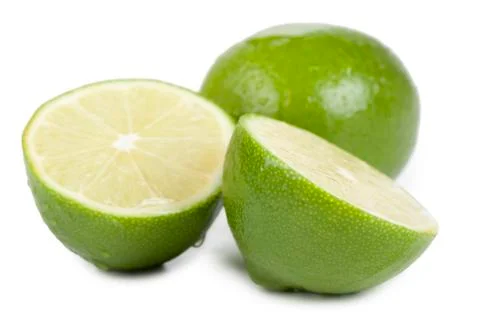 Slices of lime fruit Stock Photos