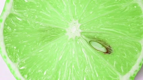 Slices of lime rotate close-up Stock Footage 166528872