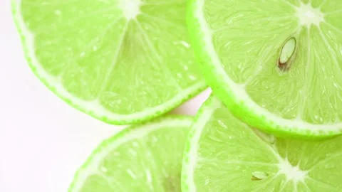 Slices of lime rotate close-up Stock Footage 169007306
