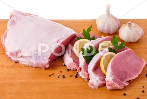 Slices of loin with lemon, parslay and garlic Stock Photos