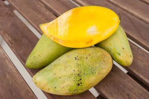 Slices mango in a pile of mango. Stock Photos