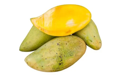 Slices mango in a pile of mango. Stock Photos