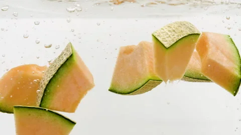 Slices of Melon Falling into Water Stock Footage 171921570